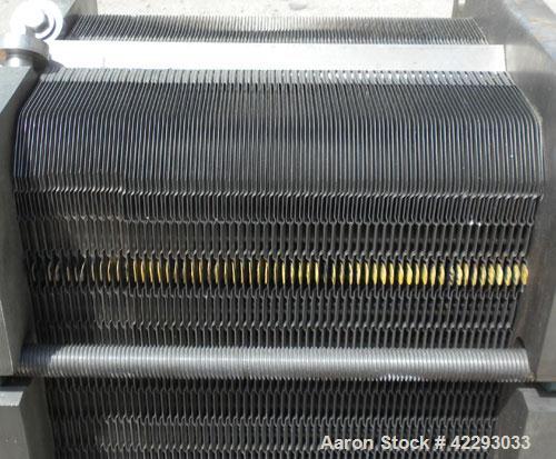 Used APV Plate Heat Exchanger, 183.2 square feet, model SR25S. (121) 32" long x 32" wide, 316 stainless steel plates. Designed for 150 PSI. 2-1/2" Sanitary inlet/outlet. Mounted on an expandable fram...