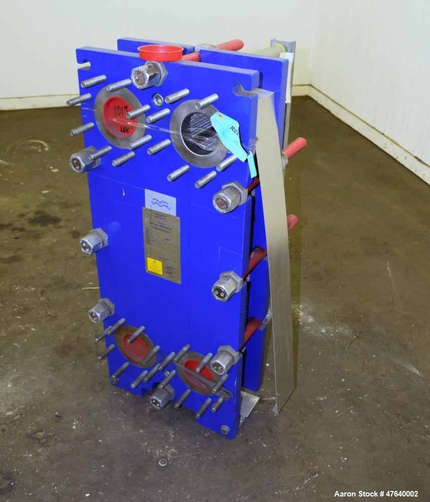 Unused- Alfa Laval Plate Exchanger, 87.83 Square Feet, Model M10-BDFG. (36) 120 mm thick 316 stainless steel plates. Designed 150 psi at -20 to 212 degrees F. (4) 3" Inlets & outlets. Mounted on a ca...