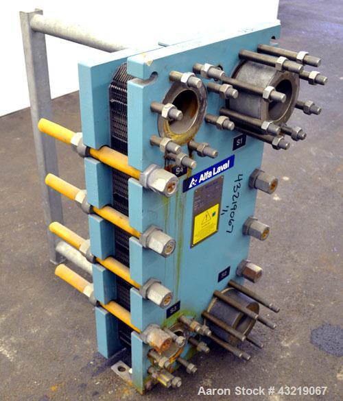 Used Alfa Laval Plate Exchanger, Approximate 84 Square Feet, Model M10-BWFD. (34) Approximately 14-3/4” wide x 34” tall Titanium plates. Rated 10 bar (145 psi) at 10 degrees C. (50 F.). (4) 3-3/4” In...