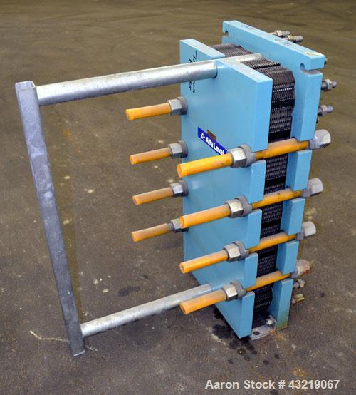 Used Alfa Laval Plate Exchanger, Approximate 84 Square Feet, Model M10-BWFD. (34) Approximately 14-3/4” wide x 34” tall Titanium plates. Rated 10 bar (145 psi) at 10 degrees C. (50 F.). (4) 3-3/4” In...