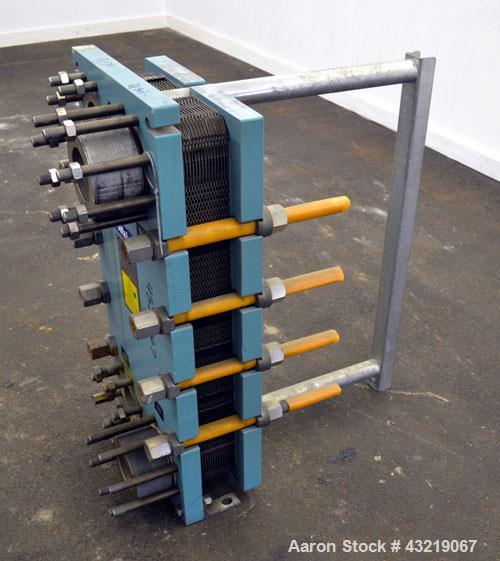 Used Alfa Laval Plate Exchanger, Approximate 84 Square Feet, Model M10-BWFD. (34) Approximately 14-3/4” wide x 34” tall Titanium plates. Rated 10 bar (145 psi) at 10 degrees C. (50 F.). (4) 3-3/4” In...