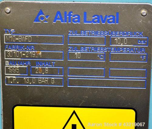 Used Alfa Laval Plate Exchanger, Approximate 84 Square Feet, Model M10-BWFD. (34) Approximately 14-3/4” wide x 34” tall Titanium plates. Rated 10 bar (145 psi) at 10 degrees C. (50 F.). (4) 3-3/4” In...