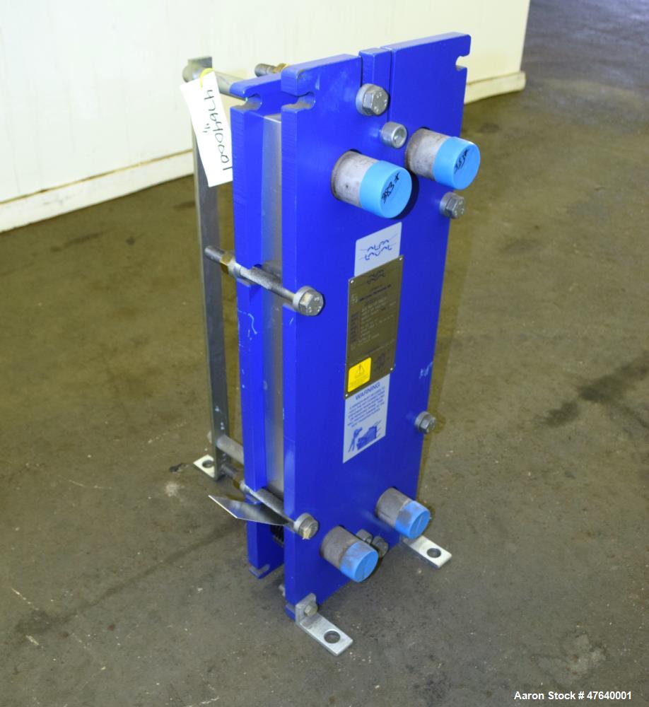 Unused- Alfa Laval Plate Exchanger, 24.11 Square Feet, Model M6-MDFG. (18) 0.75 mm thick 316 stainless steel plates. Designed 150 psi at -20 to 140 degrees F. (4) 2" Inlets & outlets. Mounted on a ca...