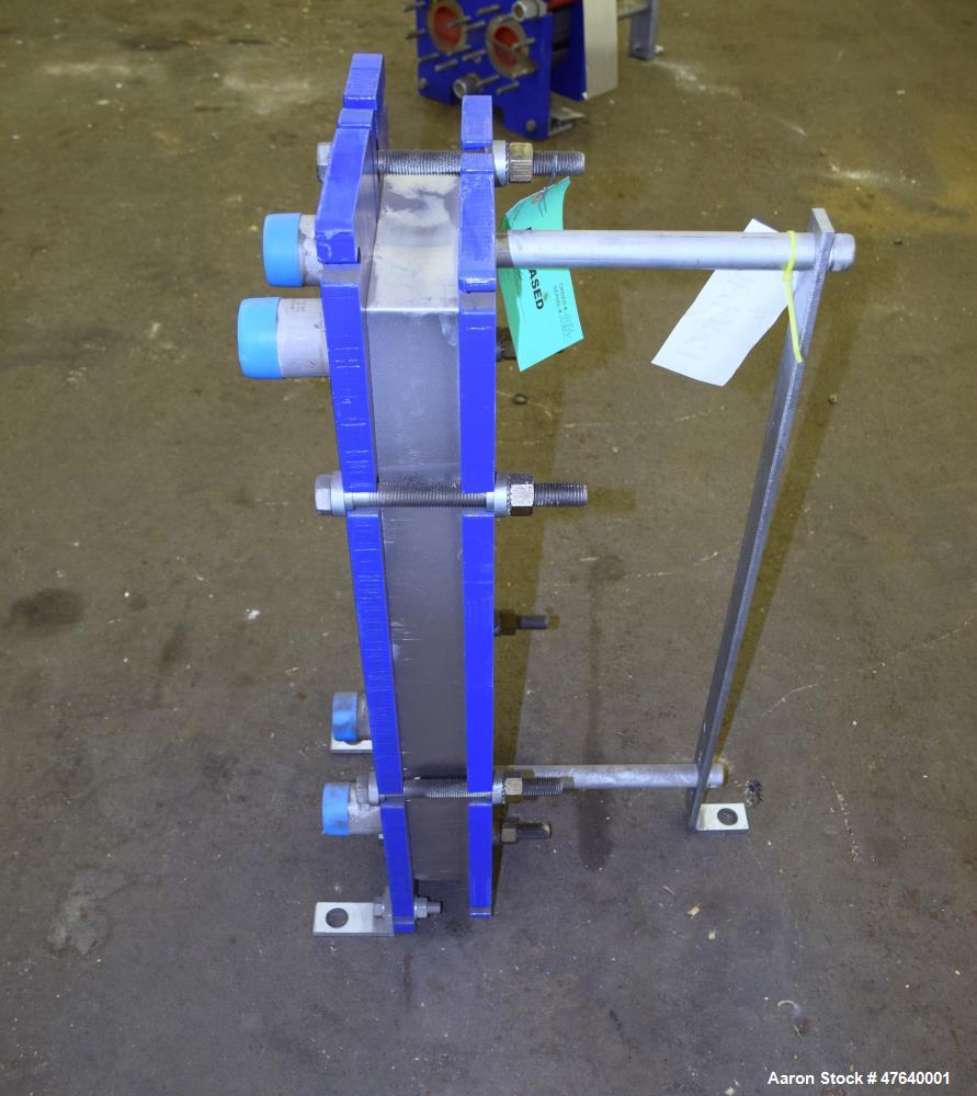 Unused- Alfa Laval Plate Exchanger, 24.11 Square Feet, Model M6-MDFG. (18) 0.75 mm thick 316 stainless steel plates. Designed 150 psi at -20 to 140 degrees F. (4) 2" Inlets & outlets. Mounted on a ca...