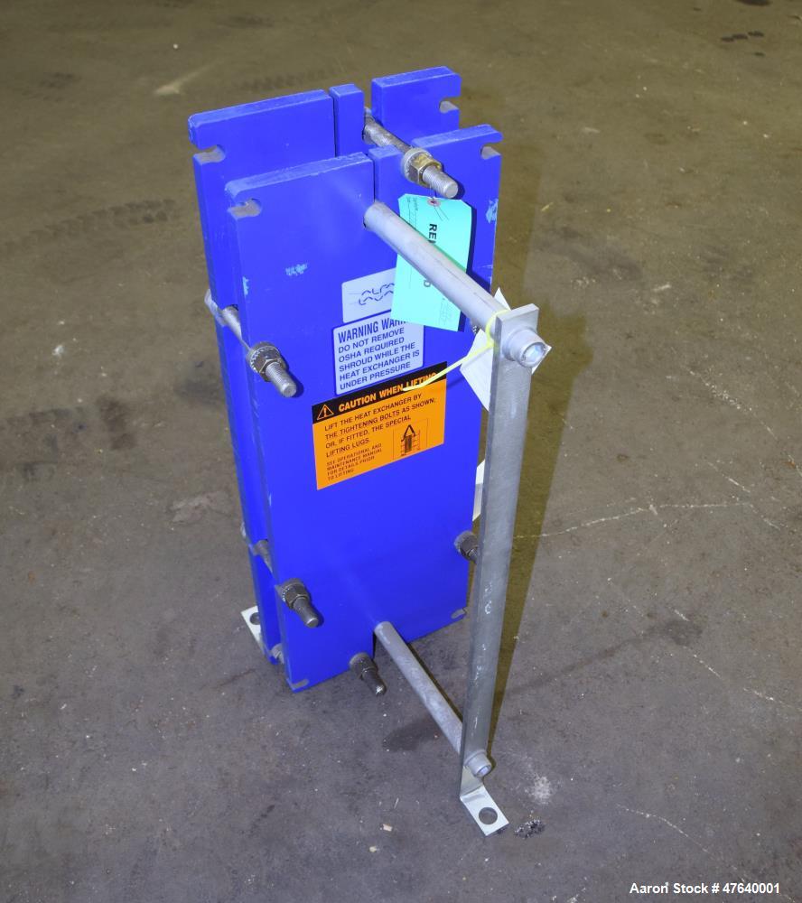 Unused- Alfa Laval Plate Exchanger, 24.11 Square Feet, Model M6-MDFG. (18) 0.75 mm thick 316 stainless steel plates. Designed 150 psi at -20 to 140 degrees F. (4) 2" Inlets & outlets. Mounted on a ca...
