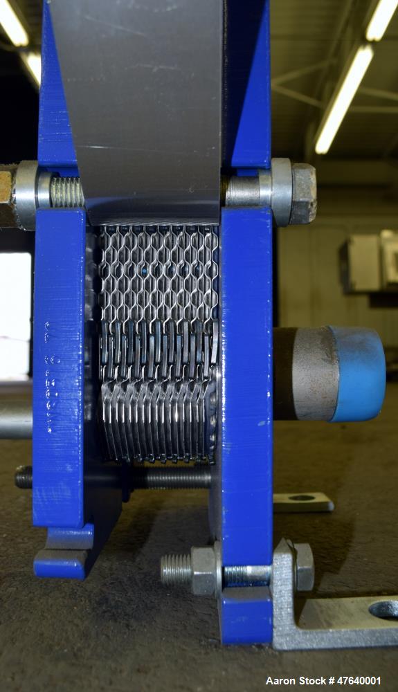 Unused- Alfa Laval Plate Exchanger, 24.11 Square Feet, Model M6-MDFG. (18) 0.75 mm thick 316 stainless steel plates. Designed 150 psi at -20 to 140 degrees F. (4) 2" Inlets & outlets. Mounted on a ca...