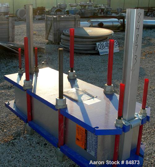 UNUSED- Alfa Laval Gasketed Plate Heat Exchanger, model M15-BFG, 727.4 square feet, 316 stainless steel. Max flow rate 2000 gallons per minute. 109 approximately 24" wide plates, rated 150 psi at 200...