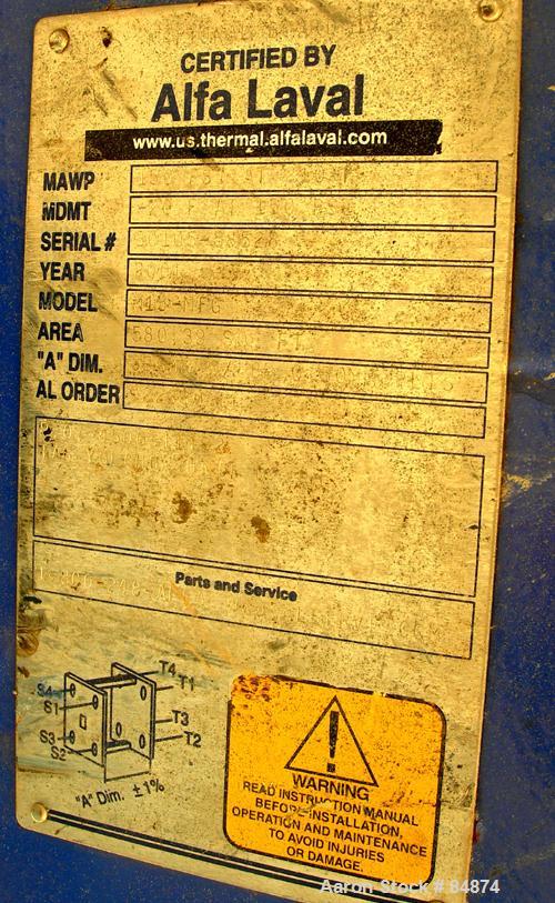 UNUSED- Alfa Laval Gasketed Plate Heat Exchanger, Model M15-MFG, 580.39 square feet, 316 stainless steel. Max flow rate 2000 gallons per minute. 89 approximately 24" wide plates, rated 150 psi at 210...