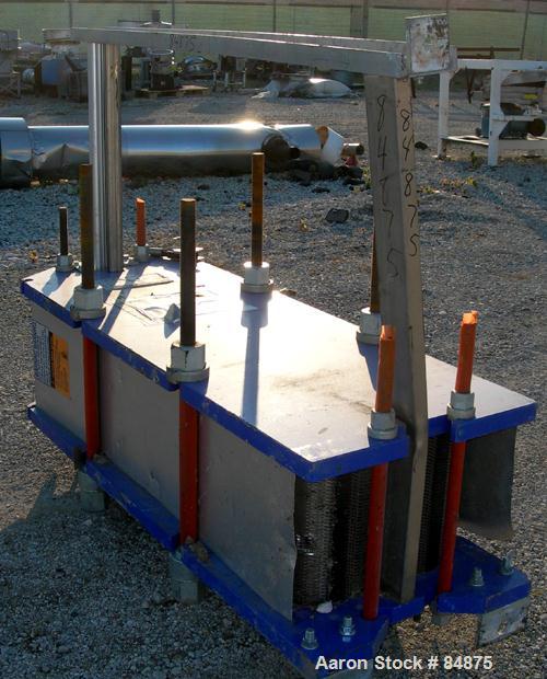 Used UNUSED- Alfa Laval Gasketed Plate Heat Exchanger, Model M15-MFG, 580.39 Square Feet, 316 Stainless Steel. Max flow rate 2000 gallons per minute. 89 approximately 24" wide plates, rated 150 PSI a...