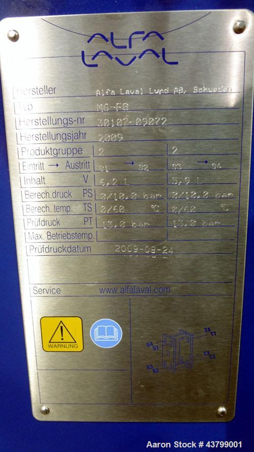 Unused- Alfa Laval Plate Exchanger, 61.35 Square Feet (5.7 Square Meters), Model M6-FG. (40) 316 Stainless steel plates. Designed 10 bar (145 psi) at 60 degrees C (140 F). (2) Inlets, (2) outlets. Mo...