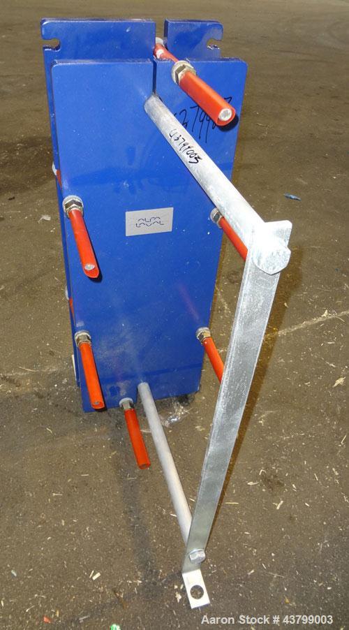 Unused- Alfa Laval Plate Exchanger, 61.35 Square Feet (5.7 Square Meters), Model M6-FG. (40) 316 Stainless steel plates. Designed 10 bar (145 psi) at 60 degrees C (140 F). (2) Inlets, (2) outlets. Mo...