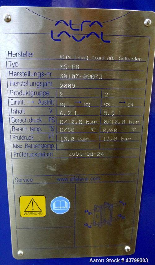 Unused- Alfa Laval Plate Exchanger, 61.35 Square Feet (5.7 Square Meters), Model M6-FG. (40) 316 Stainless steel plates. Designed 10 bar (145 psi) at 60 degrees C (140 F). (2) Inlets, (2) outlets. Mo...