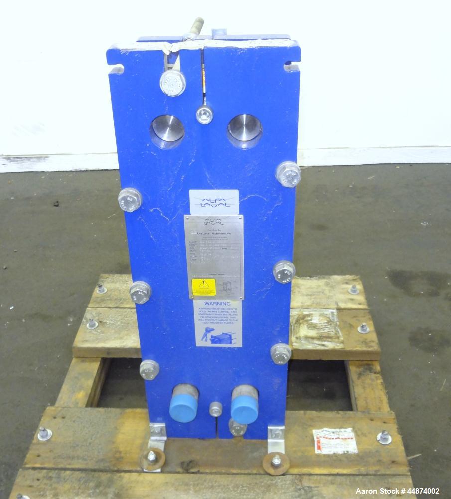 Unused- Alfa Laval Plate Exchanger, Model M6-MFD, 84.4 Square Feet.  (58) 0.60 mm Thick 316 stainless steel plates. Designed 300 psi at -20 to 250 degrees F. (2) 2" Inlets, (2) 2" outlets.  Mounted o...