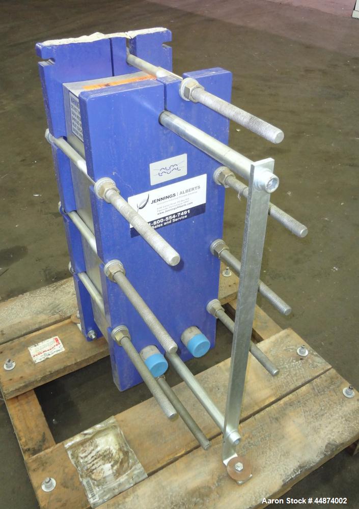 Unused- Alfa Laval Plate Exchanger, Model M6-MFD, 84.4 Square Feet.  (58) 0.60 mm Thick 316 stainless steel plates. Designed 300 psi at -20 to 250 degrees F. (2) 2" Inlets, (2) 2" outlets.  Mounted o...