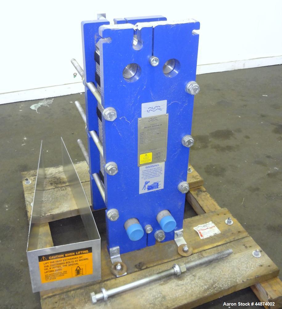Unused- Alfa Laval Plate Exchanger, Model M6-MFD, 84.4 Square Feet.  (58) 0.60 mm Thick 316 stainless steel plates. Designed 300 psi at -20 to 250 degrees F. (2) 2" Inlets, (2) 2" outlets.  Mounted o...