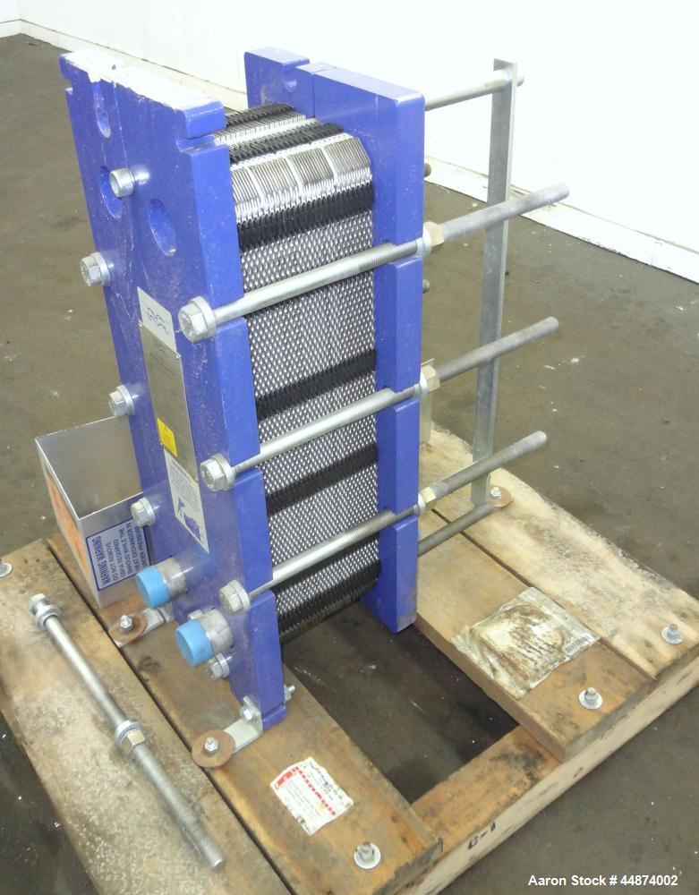 Unused- Alfa Laval Plate Exchanger, Model M6-MFD, 84.4 Square Feet.  (58) 0.60 mm Thick 316 stainless steel plates. Designed 300 psi at -20 to 250 degrees F. (2) 2" Inlets, (2) 2" outlets.  Mounted o...