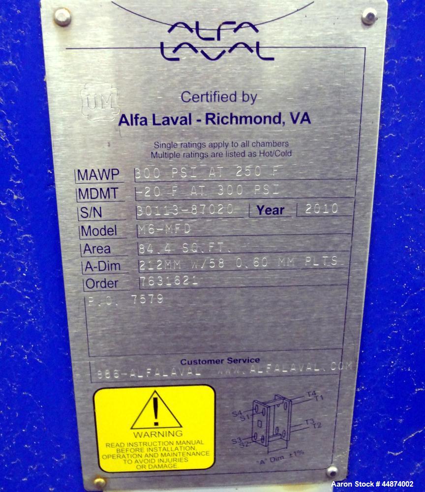 Unused- Alfa Laval Plate Exchanger, Model M6-MFD, 84.4 Square Feet.  (58) 0.60 mm Thick 316 stainless steel plates. Designed 300 psi at -20 to 250 degrees F. (2) 2" Inlets, (2) 2" outlets.  Mounted o...