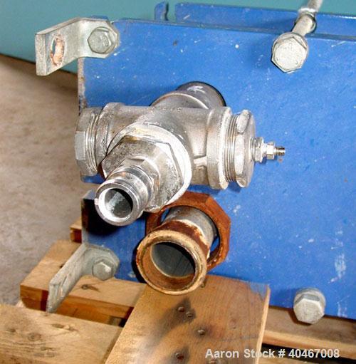 Used Alpha Laval model M6MDFG 58.75 square foot stainless steel plate heat exchanger. A-dim 153mm with (40) .75 mm plates, 2 1/2 in inlet/outlet,  150 PSI @ 230 deg F, (4) eye system.
