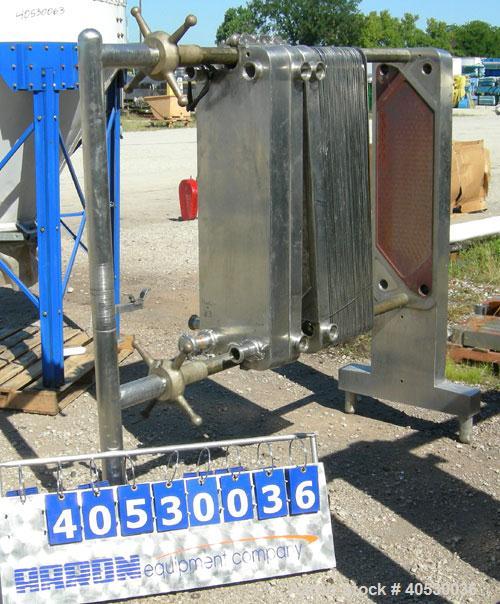 Used Cherry Burrell Plate Heat Exchanger, Model SLAS-100. Approximately 250 square feet, 304 stainless steel. (94) 13 1/2" wide x 45" long plates. 2" inlet/outlet. 2 hand wheel type tightening bars. ...