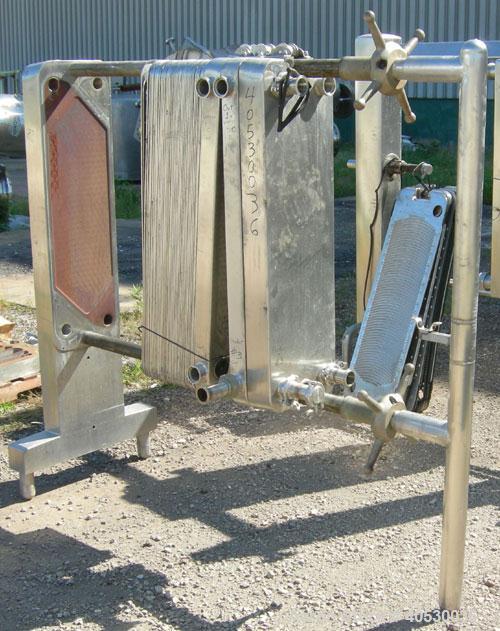 Used Cherry Burrell Plate Heat Exchanger, Model SLAS-100. Approximately 250 square feet, 304 stainless steel. (94) 13 1/2" wide x 45" long plates. 2" inlet/outlet. 2 hand wheel type tightening bars. ...