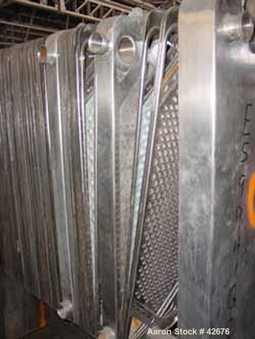 Used Cherry Burrell Plate Heat Exchanger, Model SLAS-100, Stainless Steel. Approximately 240 square feet. (86) 13-1/2" wide x 45-1/2" long plates. 48" open rail, 2 hand wheel type tightening bar. (4)...