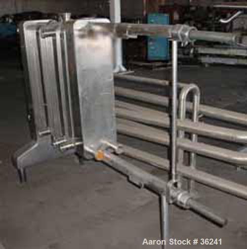 USED:Delaval plate heat exchanger, model P13RC, stainless steel.Approx 190 square feet. (147) 10" wide x 36" long plates. 3 dividerblocks. 59" open rail, 2 screw type tightening bars. (4) 2" cornerin...