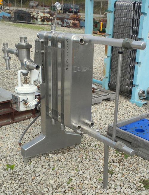 Used Delaval Plate Heat Exchanger, Approximately 81 Square Feet, Model P5-RC, 304 Stainless Steel. (55) 8-1/2" wide x 31" tall plates. (2) 2" inlet sanitary fittings, (2) 2" outlet sanitary fittings....