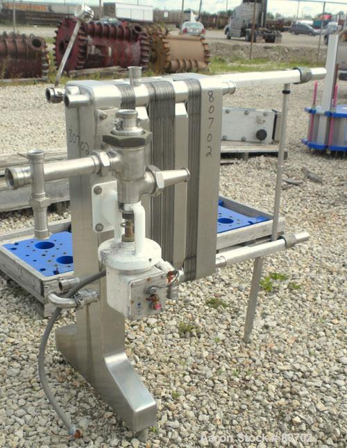 Used Delaval Plate Heat Exchanger, Approximately 81 Square Feet, Model P5-RC, 304 Stainless Steel. (55) 8-1/2" wide x 31" tall plates. (2) 2" inlet sanitary fittings, (2) 2" outlet sanitary fittings....