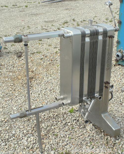 Used Delaval Plate Heat Exchanger, Approximately 81 Square Feet, Model P5-RC, 304 Stainless Steel. (55) 8-1/2" wide x 31" tall plates. (2) 2" inlet sanitary fittings, (2) 2" outlet sanitary fittings....