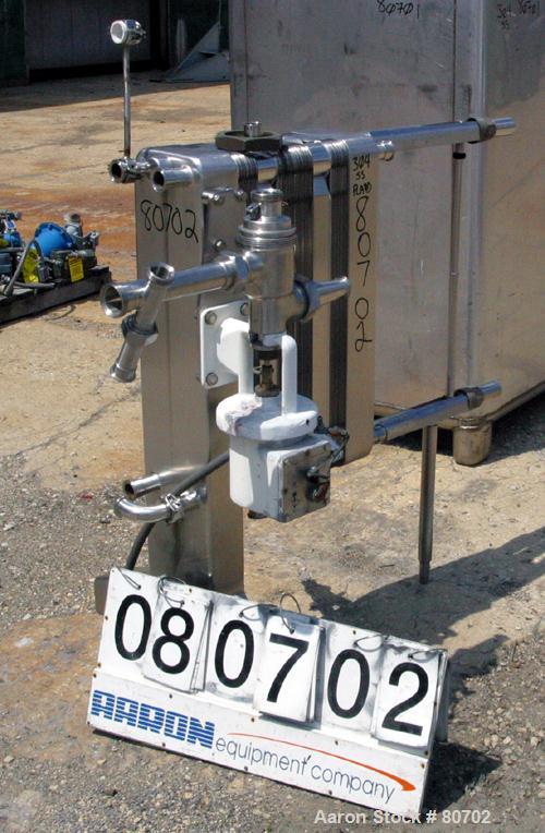 Used Delaval Plate Heat Exchanger, Approximately 81 Square Feet, Model P5-RC, 304 Stainless Steel. (55) 8-1/2" wide x 31" tall plates. (2) 2" inlet sanitary fittings, (2) 2" outlet sanitary fittings....