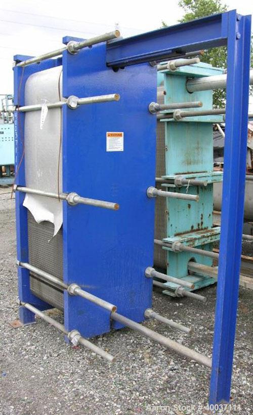 Used Paul Mueller Plate and Frame Heat Exchanger, Model AT-80B-20, 1536 square feet, 304 stainless steel. (172) Approximately 24'' wide x 70'' tall plates. Rated 150 psi at 150 deg F. 6'' inlet/outle...
