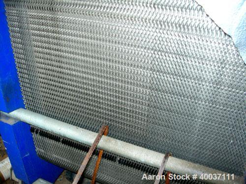 Used Paul Mueller Plate and Frame Heat Exchanger, Model AT-80B-20, 1536 square feet, 304 stainless steel. (172) Approximately 24'' wide x 70'' tall plates. Rated 150 psi at 150 deg F. 6'' inlet/outle...