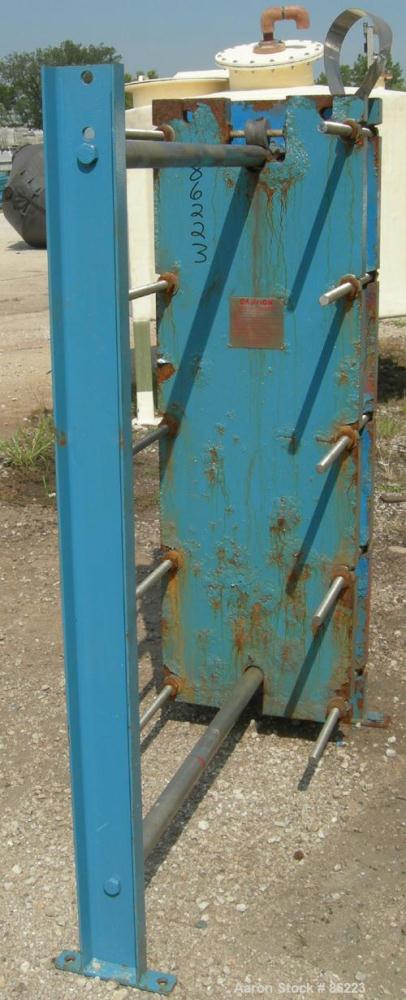 Used Mueller Accu-Therm Plate Heat Exchanger, Model AT40 F-20, approximately 202.9 square feet, 304 stainless steel. (42) plates rated 100 psi at 150 degrees F. 3" inlet/outlet. Mounted on a carbon s...