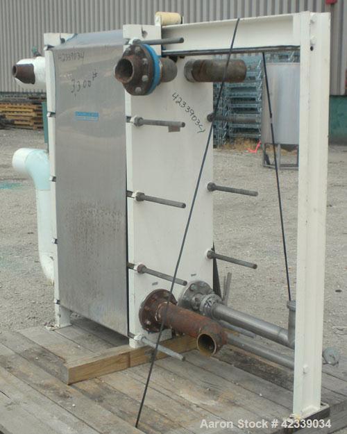 Used Mueller Plate Heat Exchanger, Approximately 831 Square Feet, Model AT40 B-20. (74) 316 Stainless steel plates. Designed for 100 psi max at 150 degrees F max. 4-1/2" inlet/outlet cold side, 3" sa...
