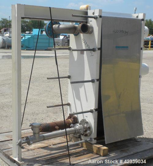 Used Mueller Plate Heat Exchanger, Approximately 831 Square Feet, Model AT40 B-20. (74) 316 Stainless steel plates. Designed for 100 psi max at 150 degrees F max. 4-1/2" inlet/outlet cold side, 3" sa...