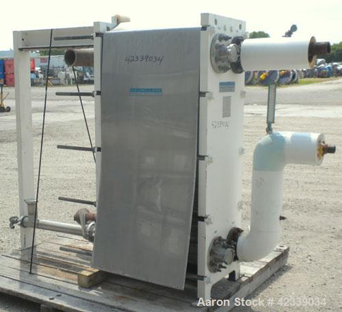 Used Mueller Plate Heat Exchanger, Approximately 831 Square Feet, Model AT40 B-20. (74) 316 Stainless steel plates. Designed for 100 psi max at 150 degrees F max. 4-1/2" inlet/outlet cold side, 3" sa...