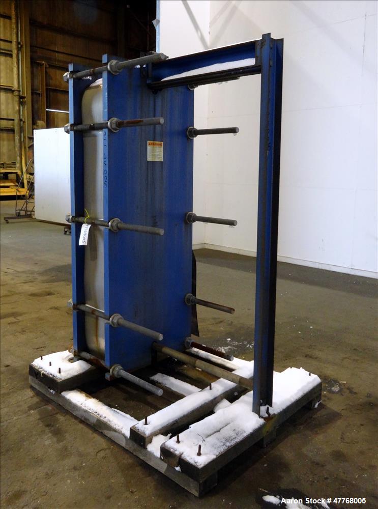 Used Mueller Accu-Therm Plate Heat Exchanger, Approximate 700 Square Feet Surface Area, Model AT80-LB-20. Approximate (82) 316 stainless steel plates rated 80psi at -20 to 300 degrees F. (4) 6-3/4" I...