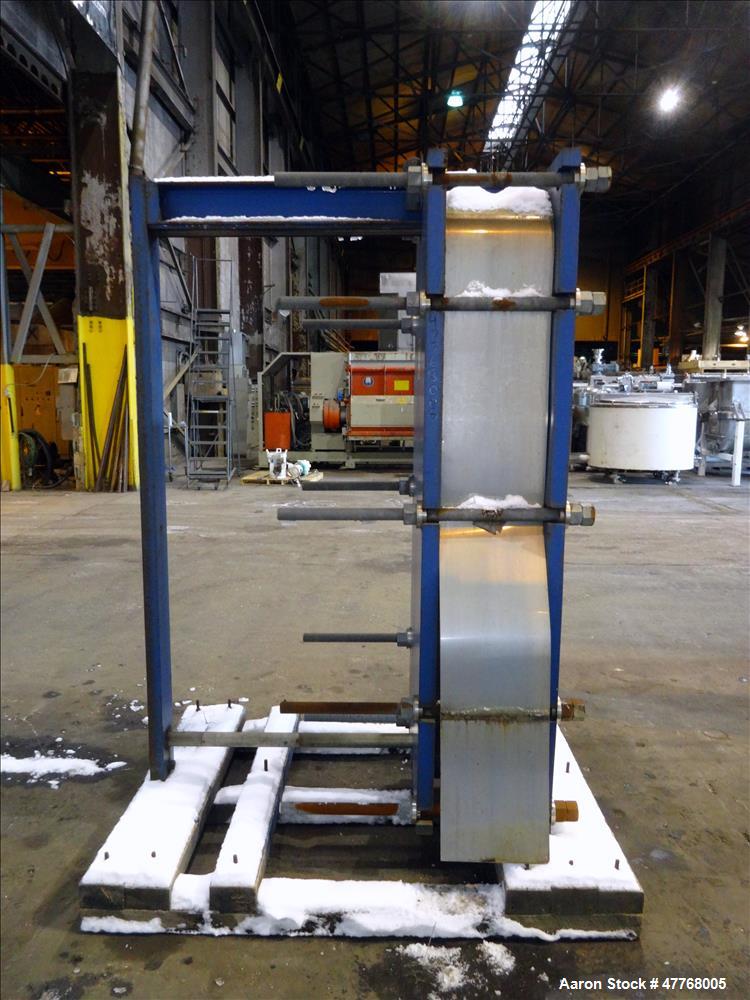 Used Mueller Accu-Therm Plate Heat Exchanger, Approximate 700 Square Feet Surface Area, Model AT80-LB-20. Approximate (82) 316 stainless steel plates rated 80psi at -20 to 300 degrees F. (4) 6-3/4" I...