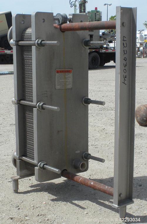 Used Mueller Plate Heat Exchanger, 117.5 Square Feet, Model AT20-SSF-10. (44) 316 Stainless steel plates. Designed for 104 psi at 250 degrees F. 2" sanitary hot inlet/outlet, 2-1/2" cold inlet/outlet...