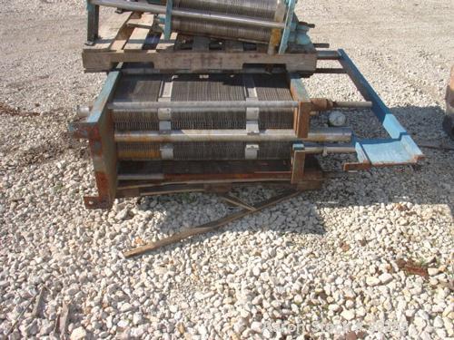 USED: Schmidt plate heat exchanger, 572 sq ft, (143) 14" wide x 48"long 316 stainless steel plates. Carbon stainless plate ends. 4" inlet/outlet.