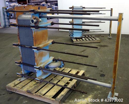 Used Tranter Superchanger Plate Heat Exchanger, Model S-3-HP-76.  250.1 Square feet.  (76) 304 Stainless steel plates.  Rated  100 psi at 200 degrees F.  (2) 2-1/2", (2) 4-1/2" inlets/outlets. Mounte...