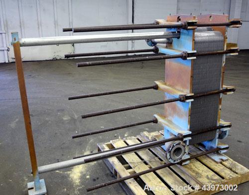 Used Tranter Superchanger Plate Heat Exchanger, Model S-3-HP-76.  250.1 Square feet.  (76) 304 Stainless steel plates.  Rated  100 psi at 200 degrees F.  (2) 2-1/2", (2) 4-1/2" inlets/outlets. Mounte...