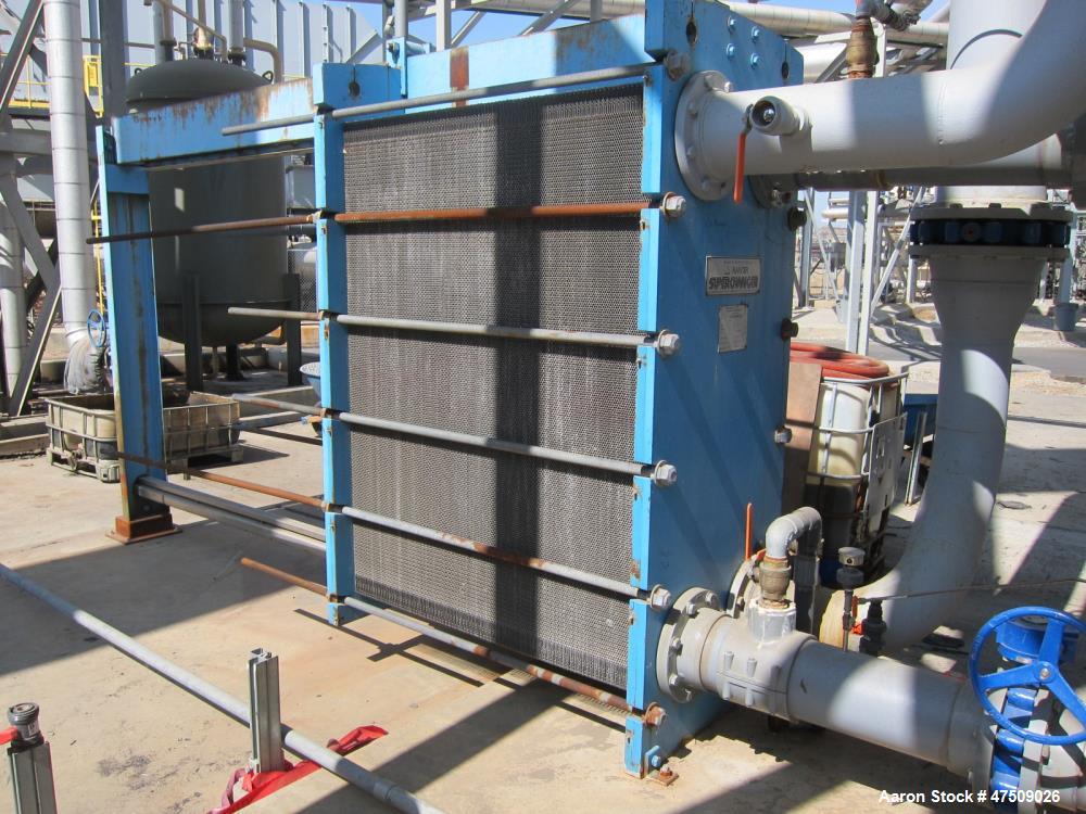 Used Tranter PHE Plate Heat Exhanger, 3751 sq ft.  Stainless steel plates.  Model UFX-100-5-HP-347, Max: 100 psi @ 150 eg F.  s/n SB 015, NB # 36131.  Yr. 2000.    Net Wt.  9921 lbs.
