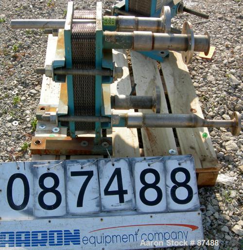 USED: Tranter Superchanger plate heat exchanger, model UX-056-UJ-24, 14 square feet, 316 stainless steel. (24) Approximately 8" wide x 20" long plates, rated 130 psi at 300 deg F. (4) 2-1/2" inlets/o...