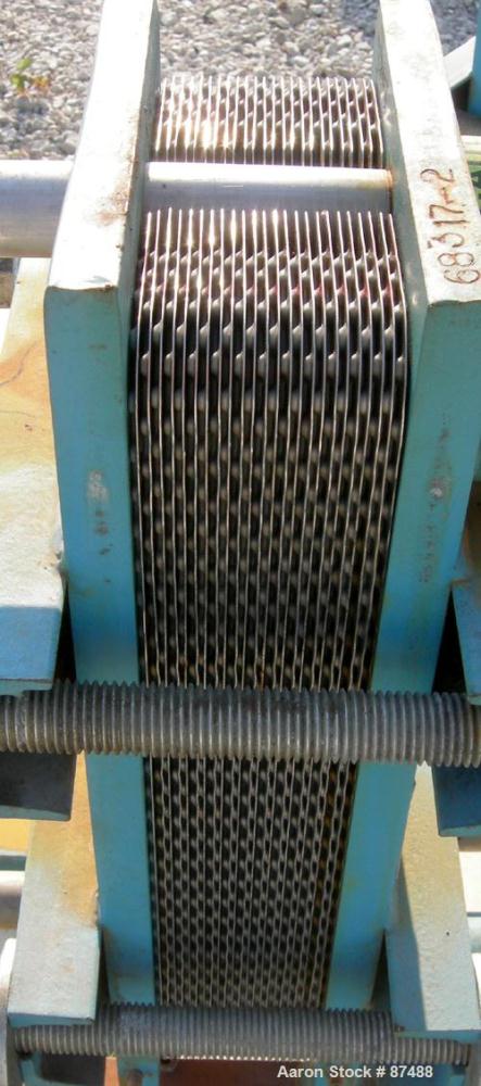 USED: Tranter Superchanger plate heat exchanger, model UX-056-UJ-24, 14 square feet, 316 stainless steel. (24) Approximately 8" wide x 20" long plates, rated 130 psi at 300 deg F. (4) 2-1/2" inlets/o...