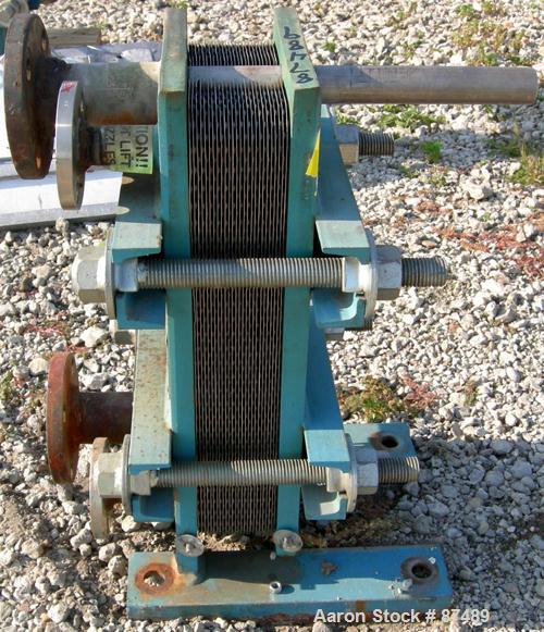 USED: Tranter Superchanger plate heat exchanger, model UX-056-UJ-26, 15.2 square feet, 304 stainless steel. (26) Approximately 8" wide x 20" long plates, rated 130 psi at 300 deg F. (2) 1", (2) 2" in...