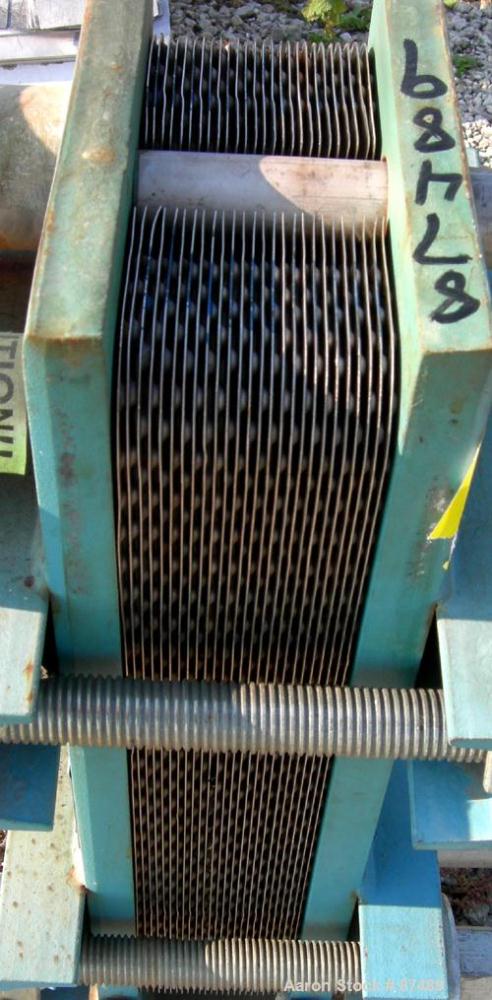 USED: Tranter Superchanger plate heat exchanger, model UX-056-UJ-26, 15.2 square feet, 304 stainless steel. (26) Approximately 8" wide x 20" long plates, rated 130 psi at 300 deg F. (2) 1", (2) 2" in...