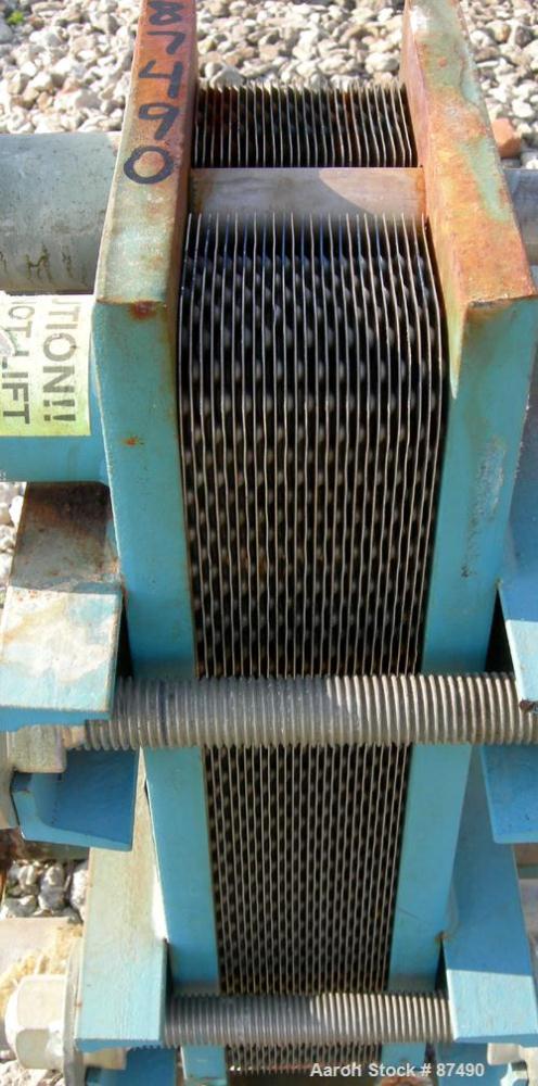 USED: Tranter Superchanger plate heat exchanger, model UX-056-UJ-26, 15.2 square feet, 304 stainless steel. (26) Approximately 8" wide x 20" long plates, rated 130 psi at 300 deg F. (4) 2" inlets/out...