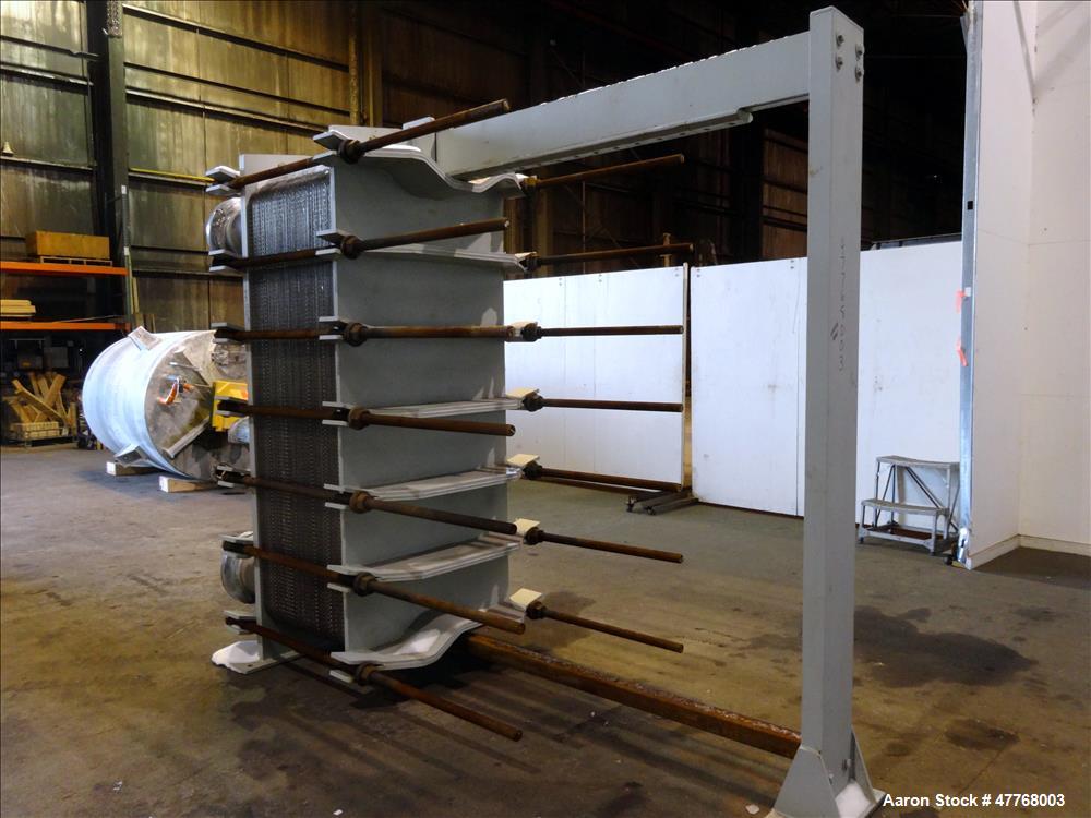 Used Tranter Superchanger Plate Heat Exchanger, Approximate 3421.8 Square Feet Surface Area, Model UX-896-UP-189. Approximate (139) 40" wide x 92" tall 316 stainless steel plates rated 125 psi at 38 ...