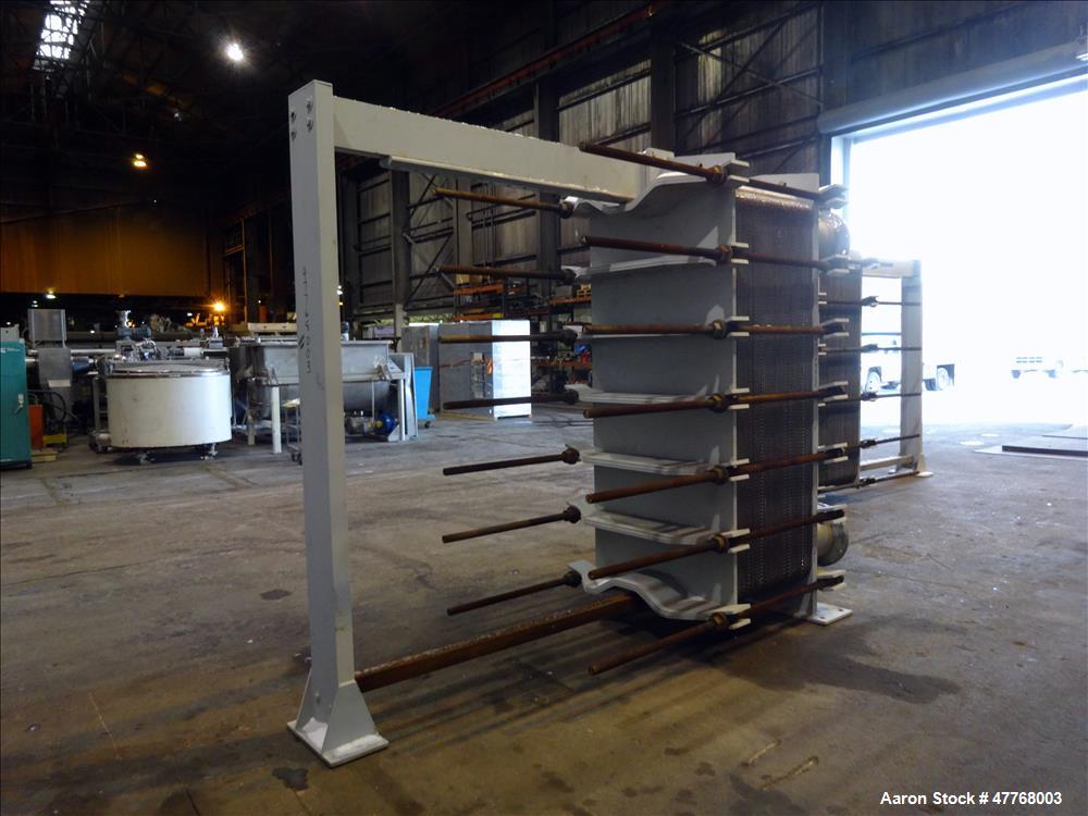 Used Tranter Superchanger Plate Heat Exchanger, Approximate 3421.8 Square Feet Surface Area, Model UX-896-UP-189. Approximate (139) 40" wide x 92" tall 316 stainless steel plates rated 125 psi at 38 ...